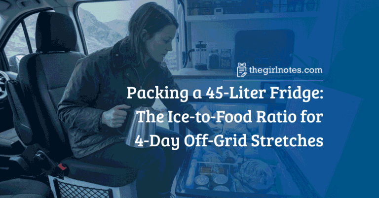 A woman in a camper van examines a heavily packed open 45-liter chest compressor fridge.
