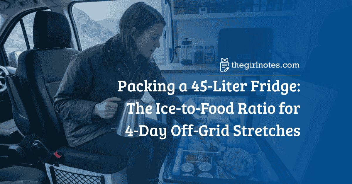 A woman in a camper van examines a heavily packed open 45-liter chest compressor fridge.